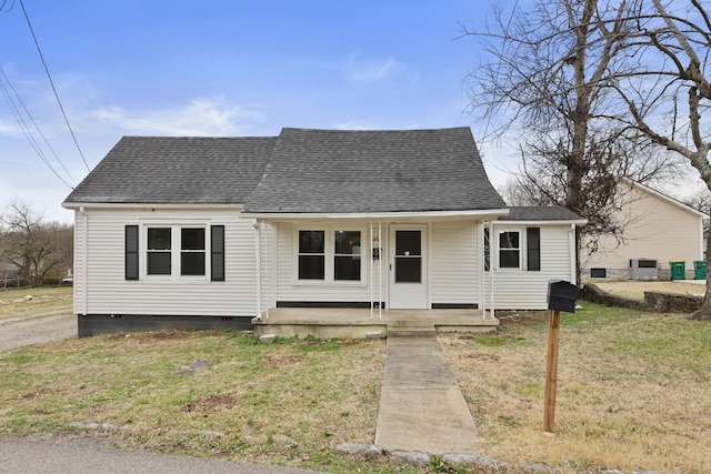 bungalow-style home with a porch and a front yard