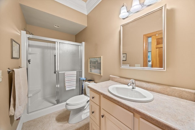 bathroom featuring tile patterned floors, toilet, crown molding, vanity, and a shower with door