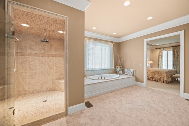 bathroom featuring ornamental molding and independent shower and bath