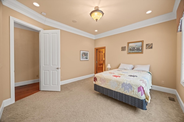 bedroom featuring crown molding and light colored carpet