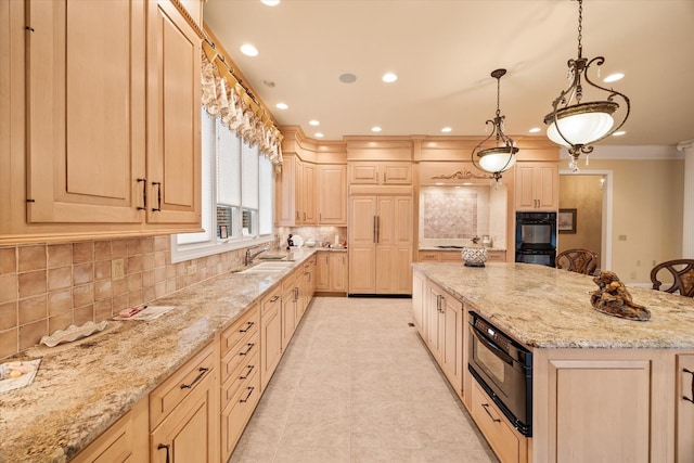 kitchen with light stone counters, decorative light fixtures, a breakfast bar area, and light brown cabinets