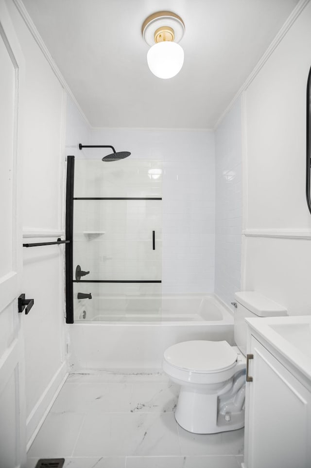 full bath featuring shower / bath combination, marble finish floor, toilet, and crown molding