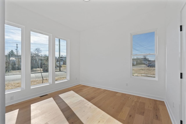 empty room with light wood-type flooring