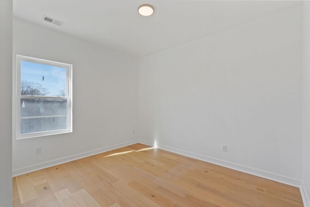 unfurnished room with light hardwood / wood-style floors