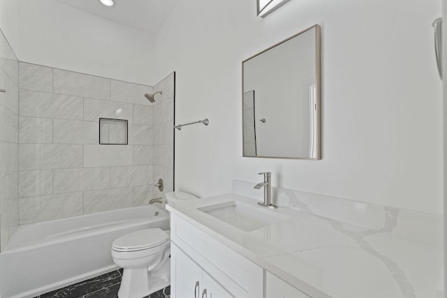 full bathroom with vanity, toilet, and tiled shower / bath combo