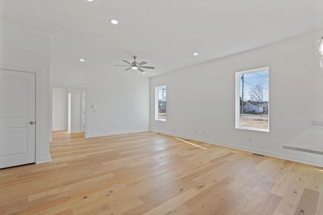 unfurnished room featuring ceiling fan and light hardwood / wood-style floors