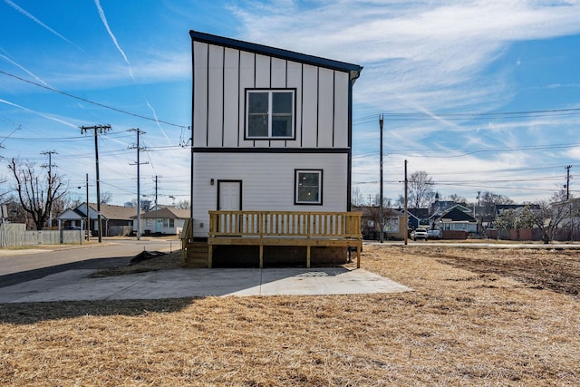 back of property featuring a deck