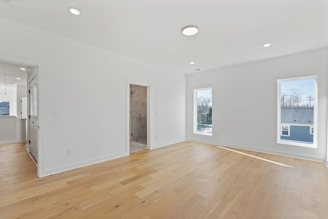 spare room with light hardwood / wood-style floors