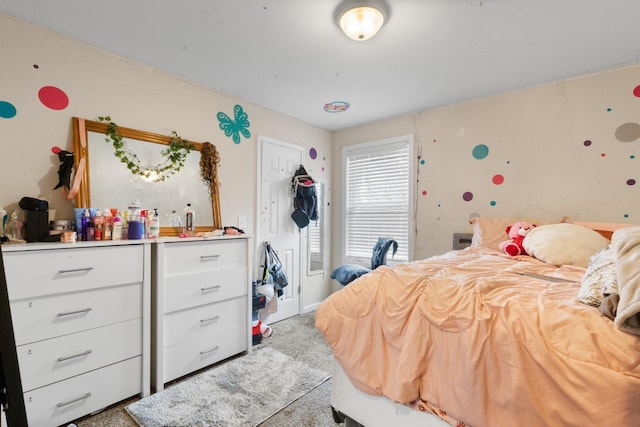 bedroom featuring light colored carpet