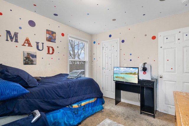 bedroom featuring light carpet