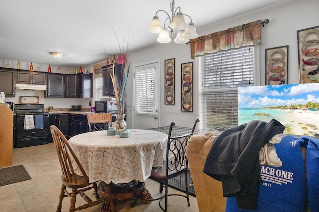 dining area featuring an inviting chandelier