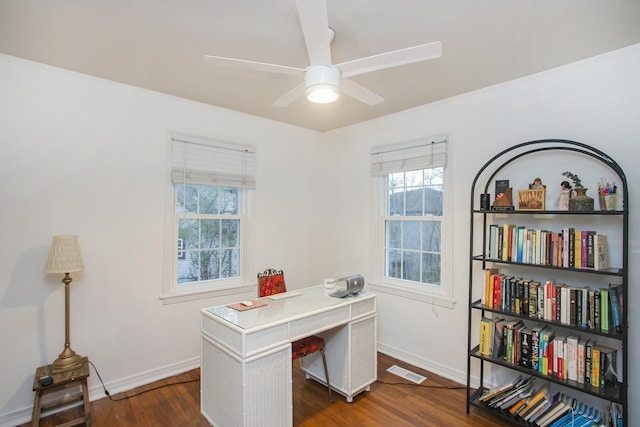 office space featuring dark hardwood / wood-style floors and ceiling fan