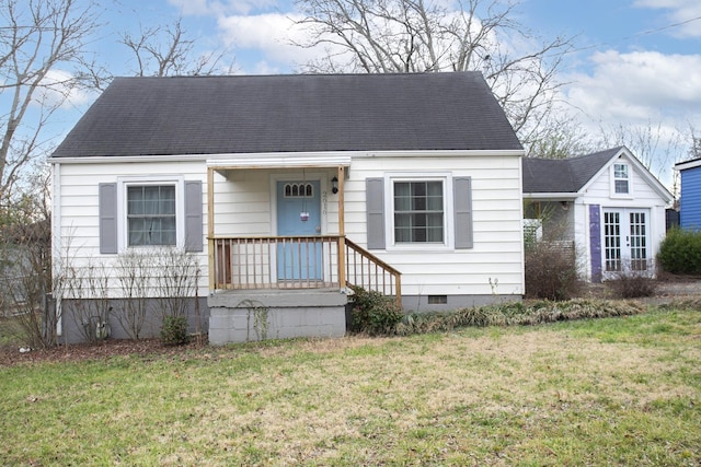 cape cod home with a front lawn