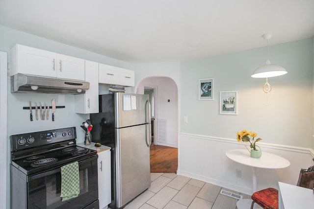 kitchen featuring white cabinetry, black range with electric stovetop, pendant lighting, and stainless steel fridge