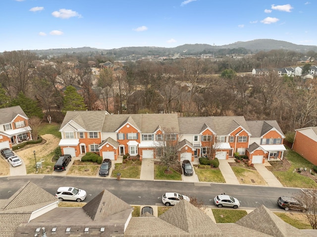 drone / aerial view featuring a mountain view