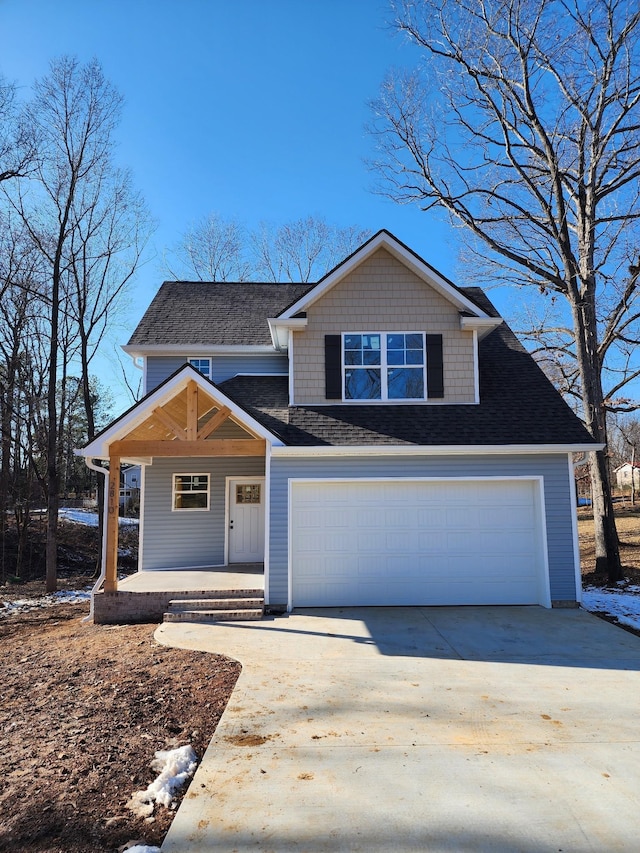 view of front of house with a garage and a porch