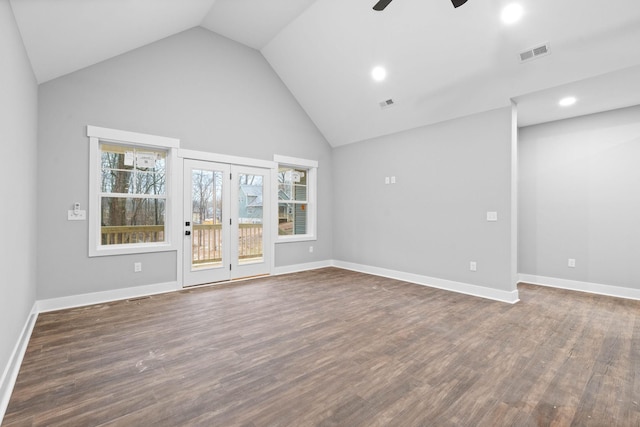 empty room with dark wood-type flooring, high vaulted ceiling, and ceiling fan