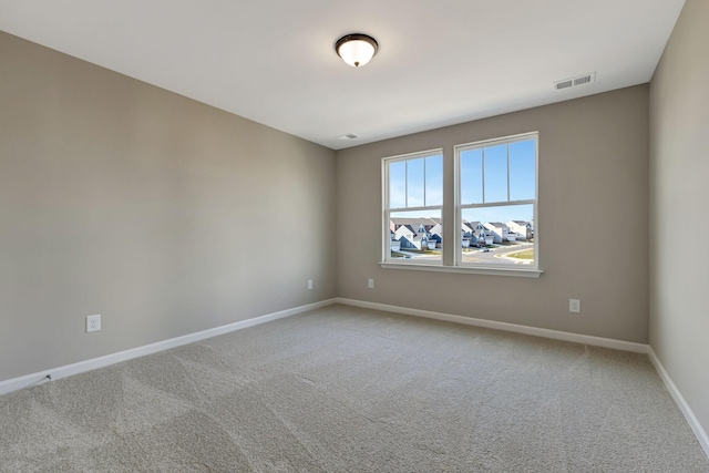 unfurnished room with carpet floors