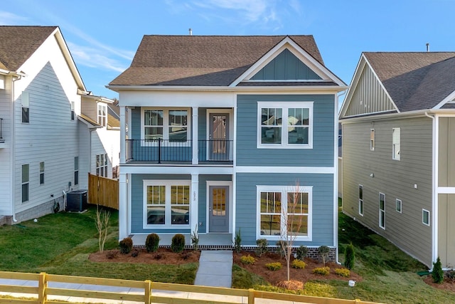 view of front of property featuring a balcony and central AC unit