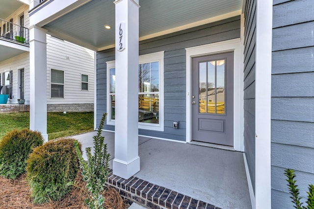 doorway to property with covered porch