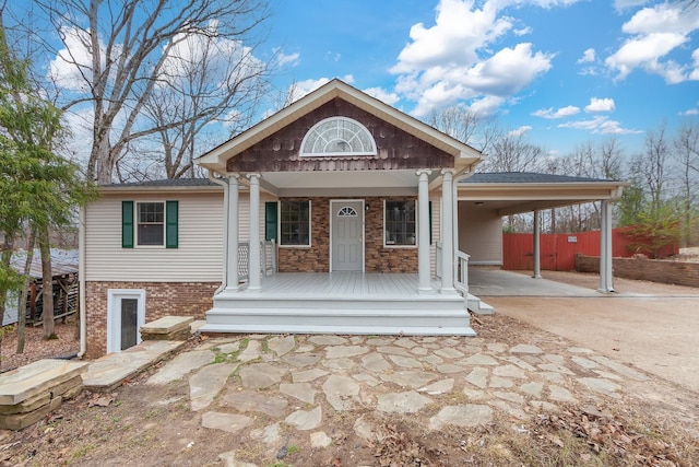 view of front of property with a carport and a porch