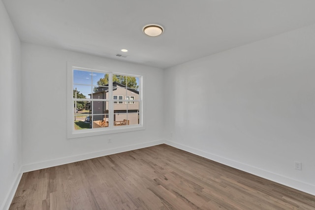 empty room with light hardwood / wood-style floors