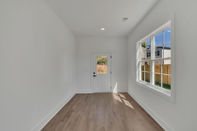 doorway to outside with light hardwood / wood-style flooring