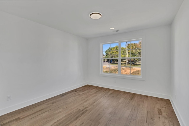 spare room featuring light wood-type flooring