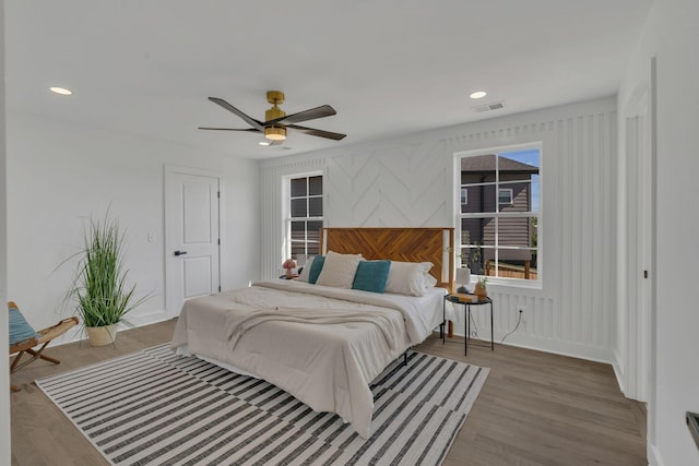 bedroom featuring wood-type flooring and ceiling fan