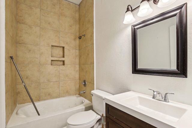 full bathroom with tiled shower / bath combo, vanity, and toilet