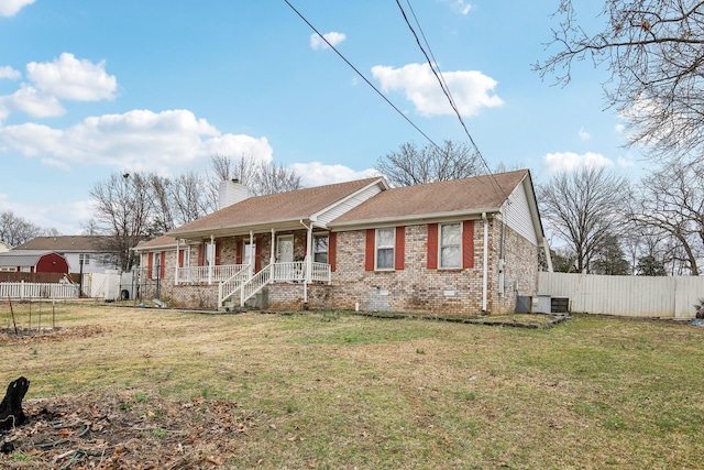 single story home featuring a front yard and covered porch