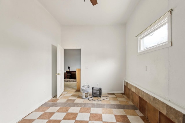 unfurnished room featuring ceiling fan