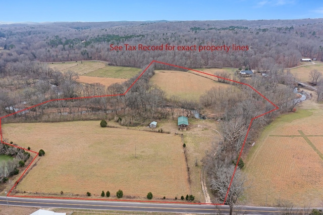 birds eye view of property with a rural view