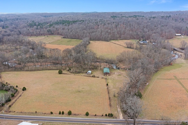 birds eye view of property with a rural view