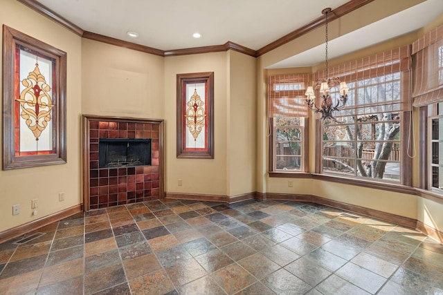 unfurnished living room featuring ornamental molding, a notable chandelier, and a fireplace