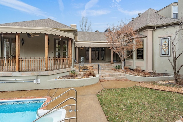 rear view of property with french doors