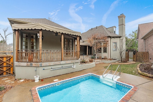 back of house with a patio area