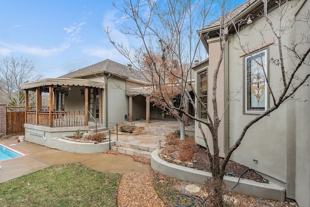 view of side of home featuring a patio area