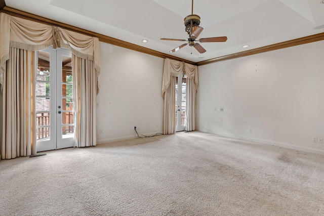 empty room featuring plenty of natural light, light carpet, and french doors