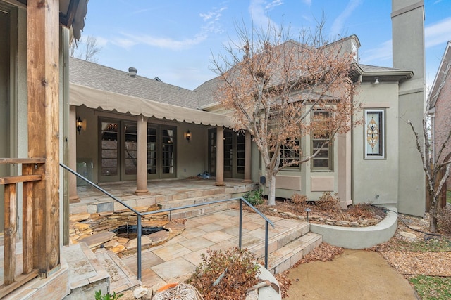 rear view of property with a patio and french doors