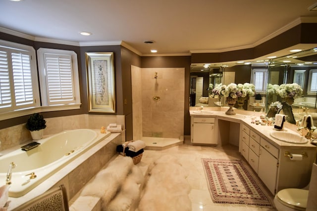 bathroom with crown molding, vanity, and independent shower and bath