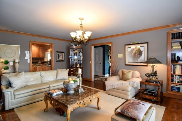 living room featuring crown molding, dark wood-type flooring, and a notable chandelier