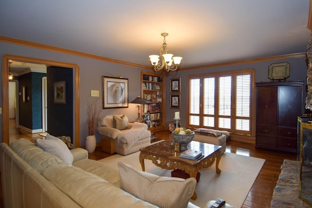 living room with ornamental molding, dark hardwood / wood-style floors, and an inviting chandelier