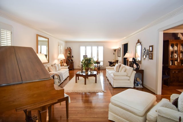 living room with ornamental molding and hardwood / wood-style floors