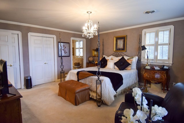 bedroom with ornamental molding, two closets, light carpet, and a chandelier