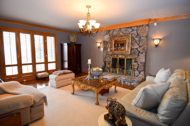 living room featuring ornamental molding, a stone fireplace, and a chandelier