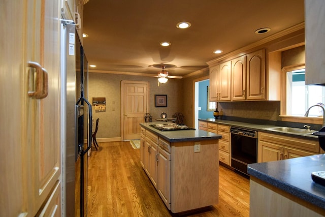 kitchen featuring dishwasher, a kitchen island, sink, and light brown cabinetry