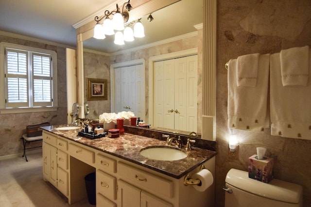 bathroom with crown molding, vanity, and toilet