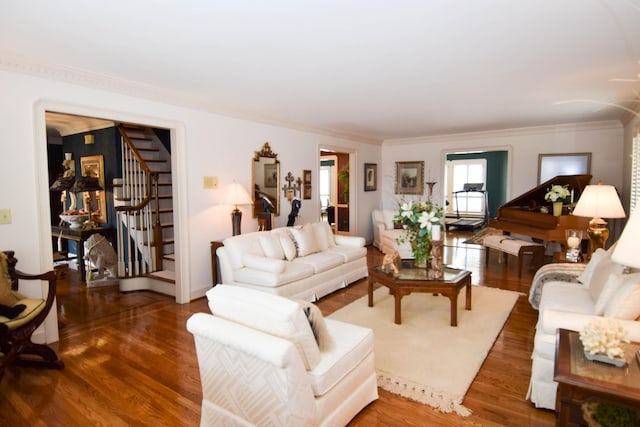 living room with crown molding and dark hardwood / wood-style floors