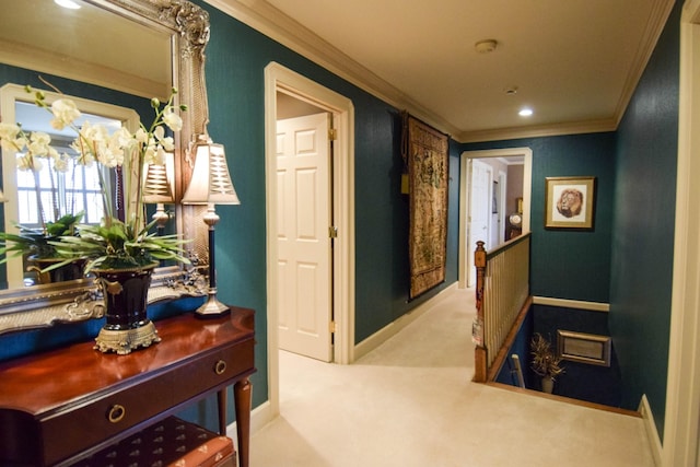 hallway featuring ornamental molding and light colored carpet